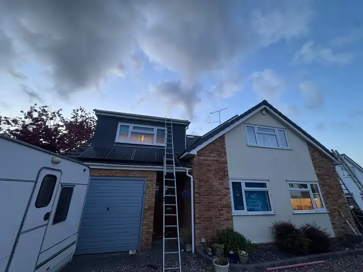 Chalet house during its re-roof with ladder up the front