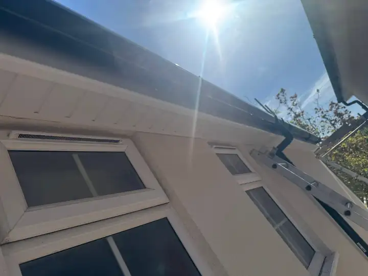 New white soffit and gutter at the eaves of the Farnham house