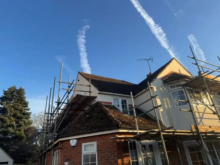 Scaffold up round the Farnham house for the complete new roof