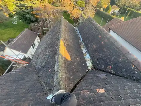 Old plain tile hips and valley on the Farnham roof before the strip