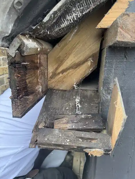 Rotten timber at the corner of a dormer frame, uncovered during the repair